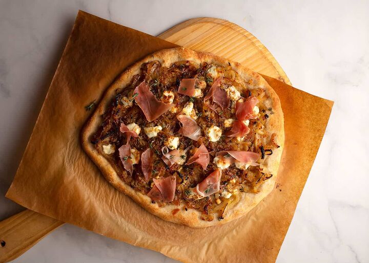 caramelized onions goat cheese pizza, A Drizzle of balsamic vinegar and prosciutto finish the pizza