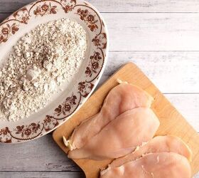 classic chicken marsala, Chicken cut in half horizontally next to a platter of seasoned flour
