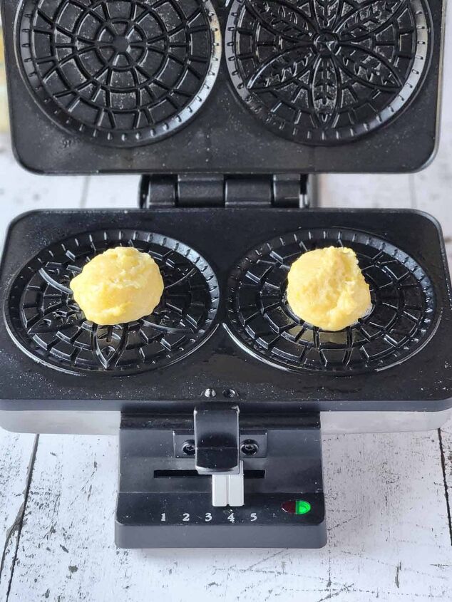easy lemon pizzelle italian waffle cookies, Batter on a pizzelle maker for lemon pizzelles