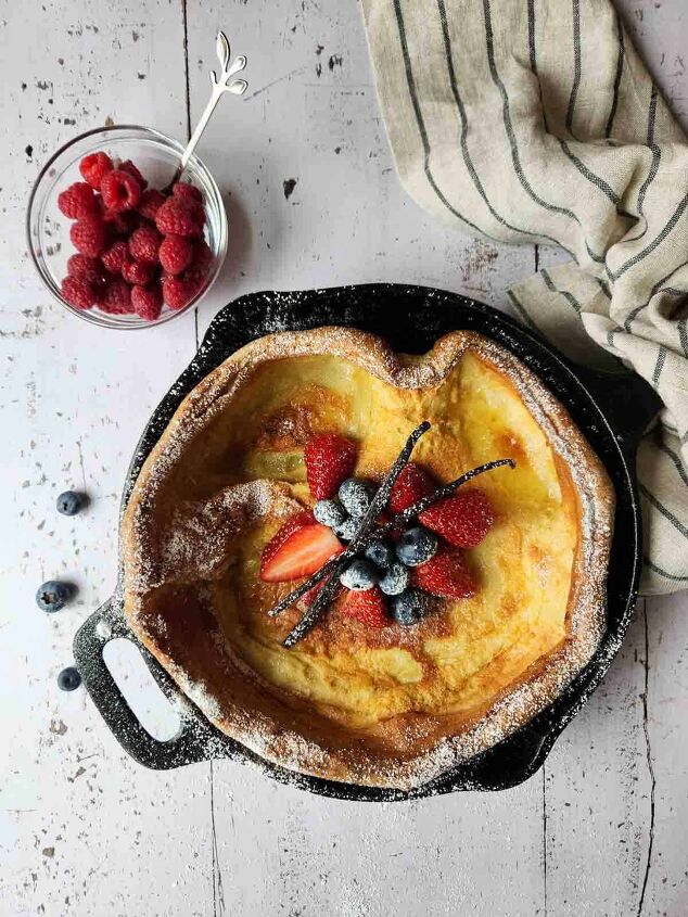 sweet vanilla dutch baby pancake, Overhead of fruit toppings in the center of a Dutch baby