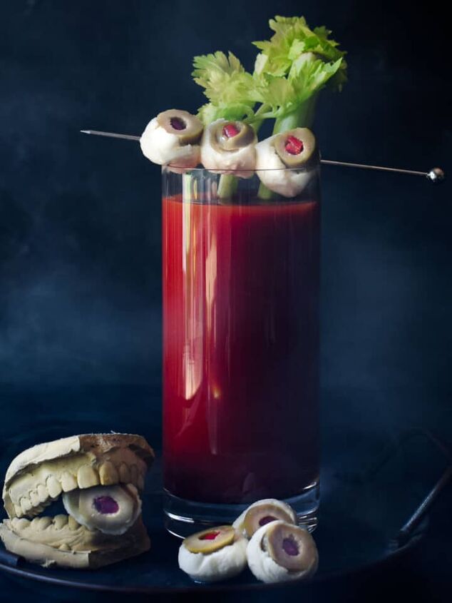 decadent malted milk hot chocolate, Bloody Mary with celery and mozzarella garnish on a black background