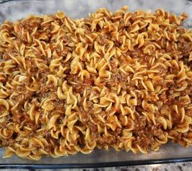 easy cheesy beef noodle casserole recipe, meat and noodles spread into a baking dish