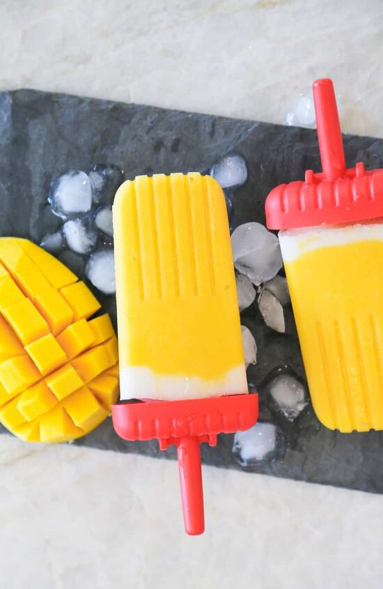 vegan gluten free mango popsicles, homemade mango popsicles with ice and cut up mango