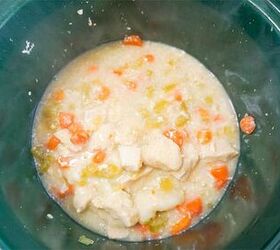 slow cooker chicken and dumplings, chicken soup and dumplings in a green crockpot