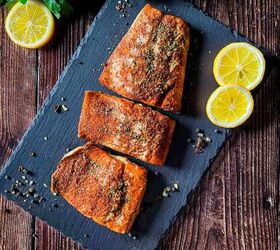 best smoked salmon on pellet grill recipe, Smoked salmon fillet baked to perfection placed on a slate board with slices of lemon beside it