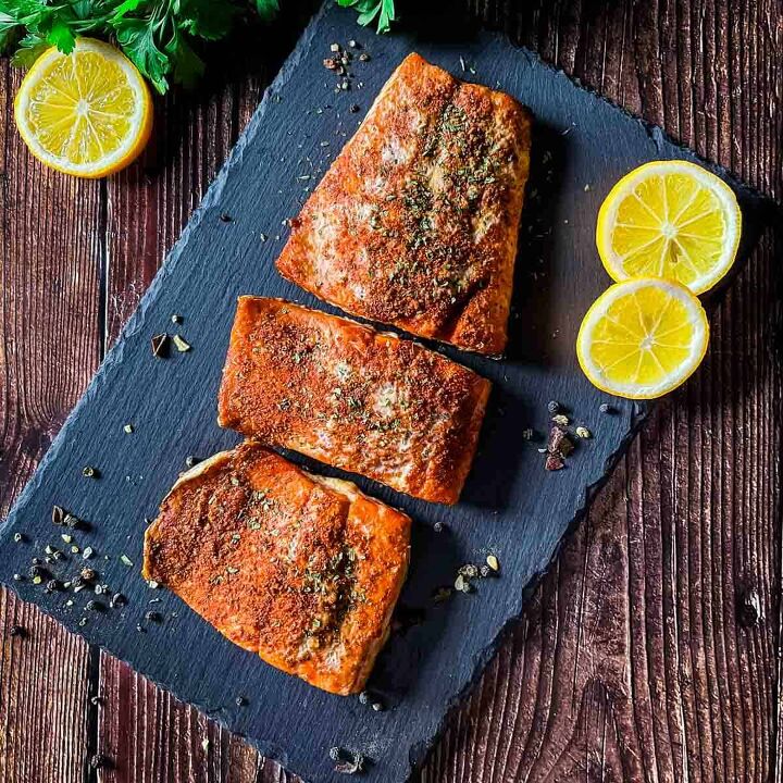 best smoked salmon on pellet grill recipe, Smoked salmon fillet baked to perfection placed on a slate board with slices of lemon beside it