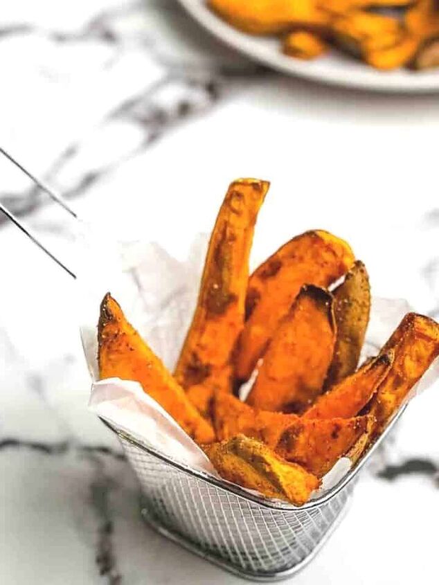 easy twice baked mashed potato recipe, A closeup of sweet potato wedges in a fry basket