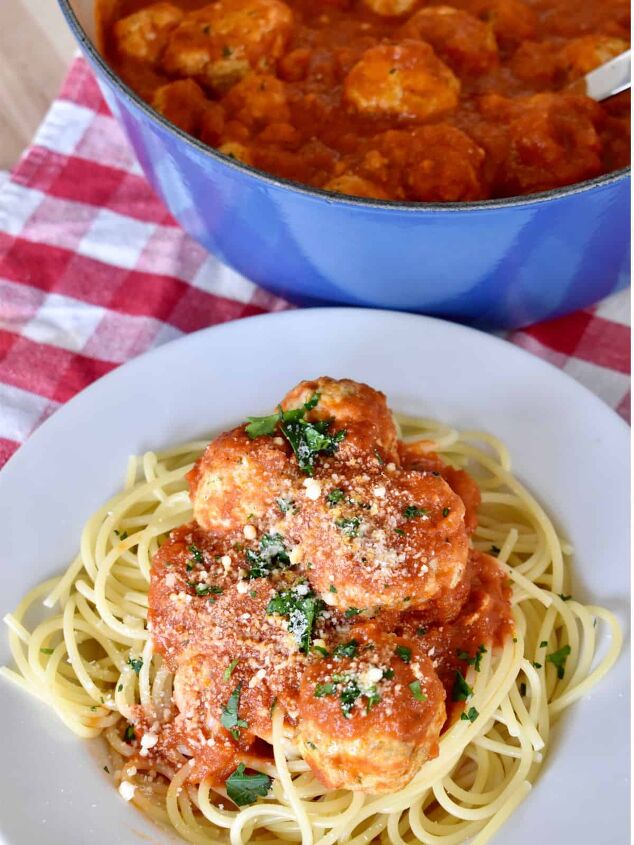 turkey ricotta meatballs recipe ricotta baked meatballs, Turkey Ricotta Meatballs in a large dutch oven with a plate of meatballs and spaghetti next to i