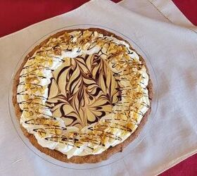 easy peanut butter pie with chocolate ganache, overhead view of a chocolate peanut butter pie with whipped cream