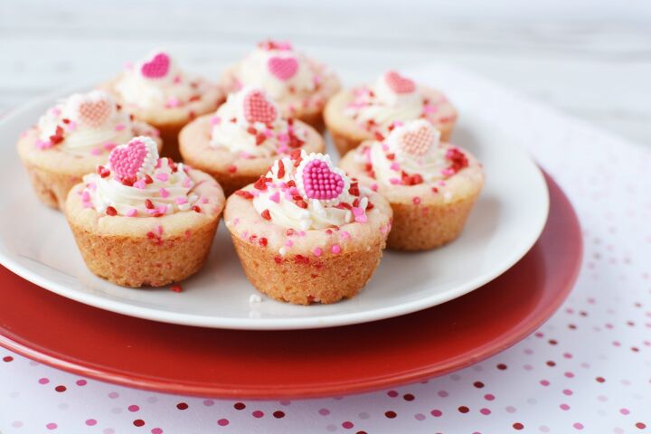 valentine s day sugar cookie cups, Sugar Cookie Cups filled with frosting and covered with red and pink sprinkles sitting on stainless steel cooling racks
