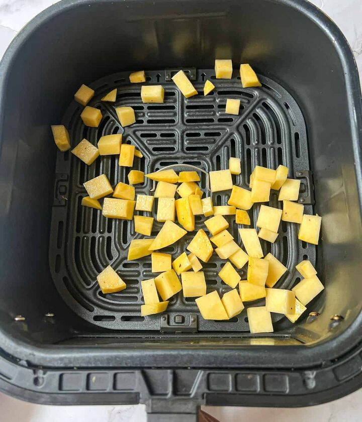 roasted swede oven and air fryer, Cubes of raw swede in an air fryer basket