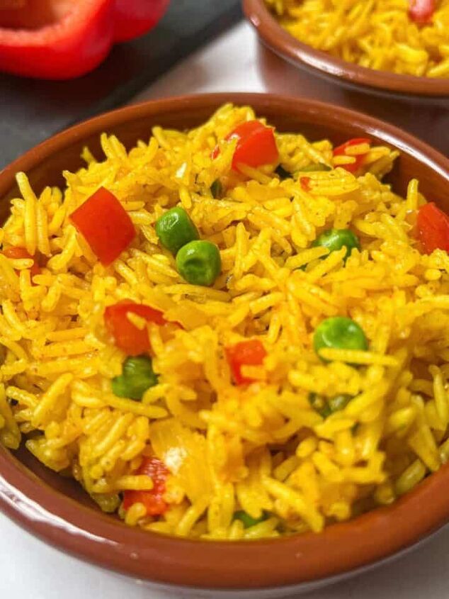 roasted swede oven and air fryer, Homemade Nandos spicy rice in a brown bowl with another bowl of rice in the background