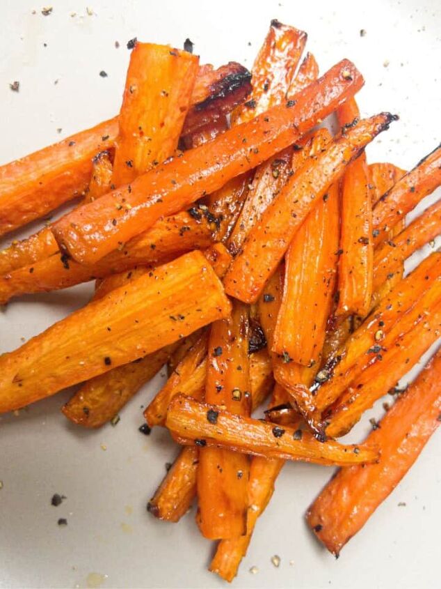 roasted swede oven and air fryer, Cooked carrot sticks sprinkled with black pepper