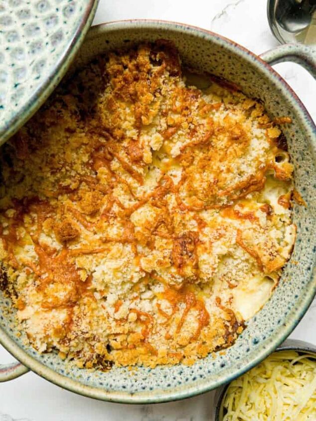 roasted swede oven and air fryer, Cauliflower cheese in a casserole dish with the lid propped on the side with a side bowl of cheese