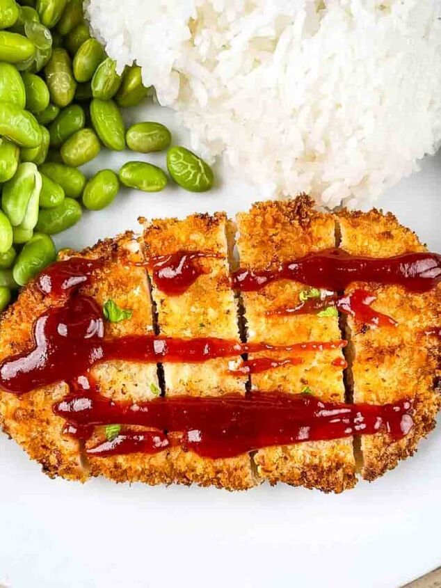 air fryer whole roast chicken with lemon and garlic, Golden crispy Chicken Katsu served on a white plate with a side of steamed white rice and green edamame garnished with a lemon wedge and drizzled with tonkatsu sauce