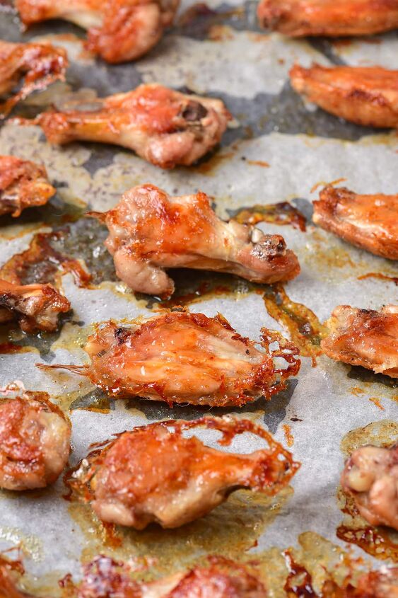 crispy garlic parmesan wings, Chicken wings on parchment paper