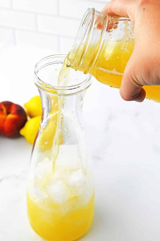 peach lemonade, pouring peach juice into pitcher