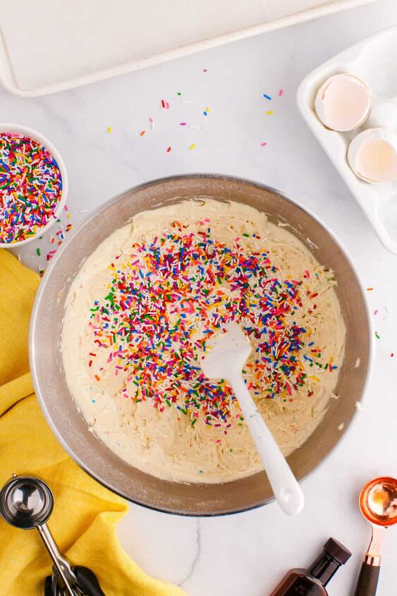 funfetti cake mix cookies, Mixing sprinkles into the funfetti cookie dough in a mixing bowl from above on a counter