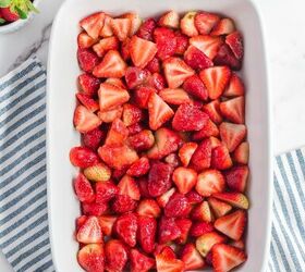 fresh strawberry cobbler, Sliced strawberries mixed with sugar layered in a large baking dish from above