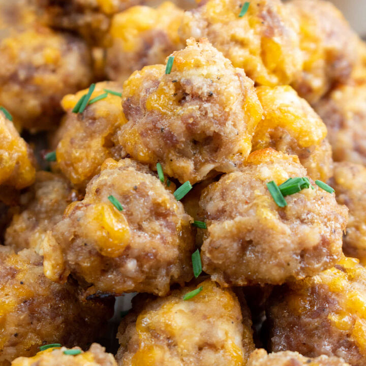 sausage and cheese balls, A close up of sausage cheese balls garnished with freshly chopped chives