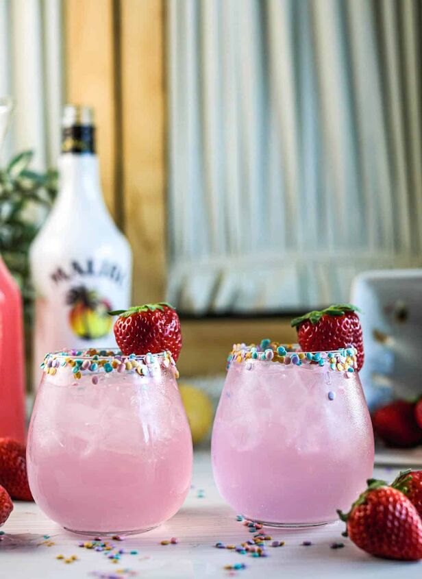 drunk bunny cocktail perfect for a grown up easter, Pink cocktails with sprinkles on rim with strawberries and sprinkles on table
