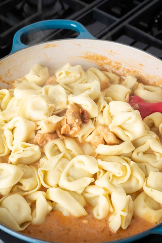 marry me chicken tortellini, Adding the tortellini to the pan to coat with sauce
