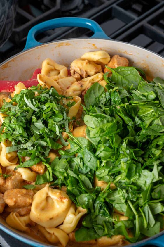 marry me chicken tortellini, Adding spinach and fresh basil to the pan of marry me chicken tortellini