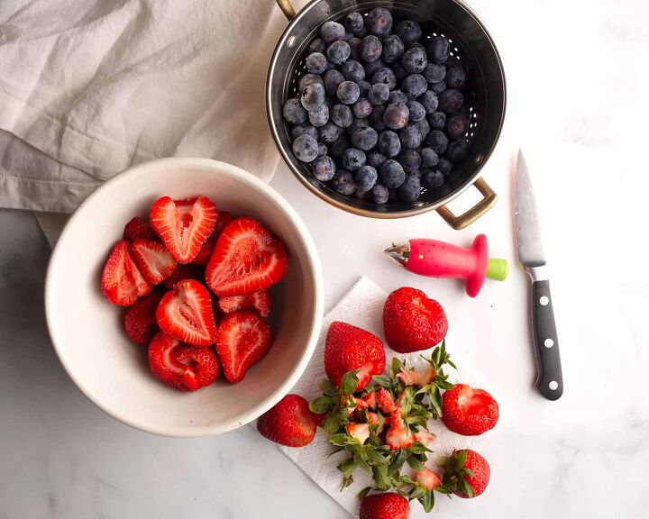 berry ricotta cake, Blueberries in a copper colander strawberries in a vintage bowl
