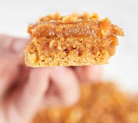 peanut butter brownie blondies, Holding a slice of keto peanut butter brownie