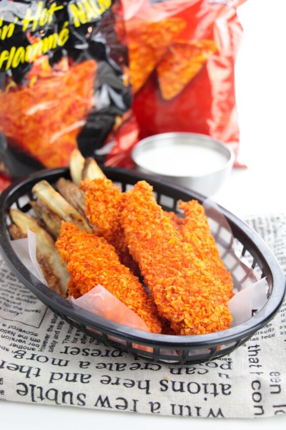 doritos chicken tenders, doritos chicken strips and fries in a basket next to dipping sauce