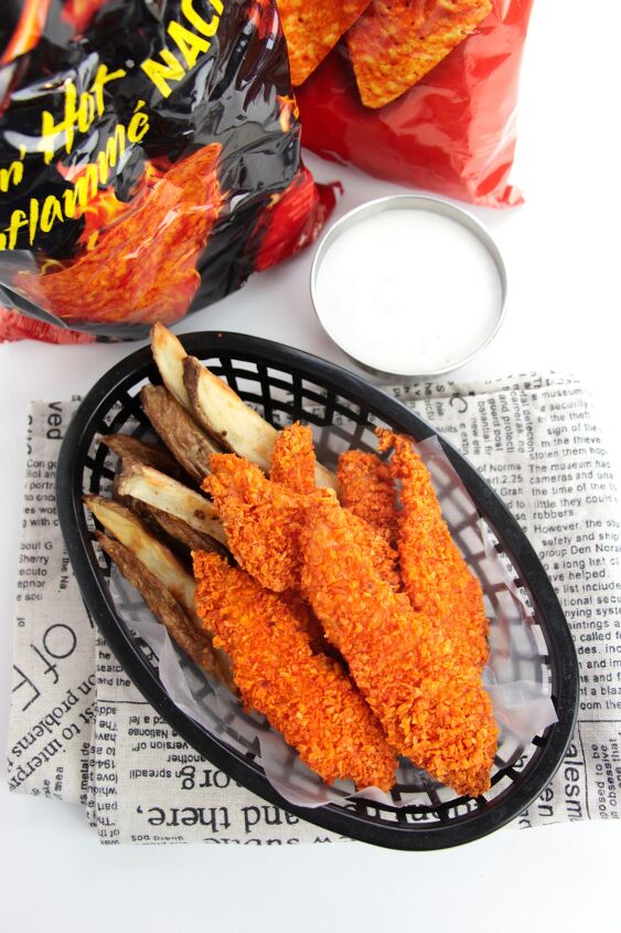 doritos chicken tenders, doritos chicken fingers and fries in a basket next to dipping sauce