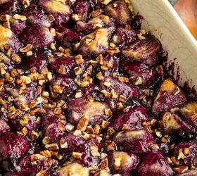 blueberry cobbler bubble up, A baked Blueberry Cobbler Bubble Up dessert featuring pieces of fruit and nuts in a rectangular dish The fruit appears browned on the edges and is covered with a layer of crushed nuts