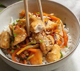 pineapple chicken recipe a burst of sweet savory goodness, A bowl of Pineapple Chicken and vegetables over rice garnished with sesame seeds