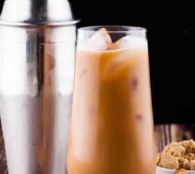 how to make the best iced coffee at home, Brown sugar shaken espresso in a tall glass with a cocktail shaker and brown sugar in the background