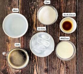 how to make the best iced coffee at home, The ingredients for iced coffee at home measured out and placed in small containers on a wood table