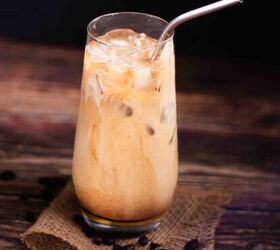 how to make the best iced coffee at home, A tall glass of DIY coffee with a metal straw