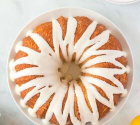 this lemon bundt cake recipe makes me happy, overhead view of lemon bundt cake with white icing drizzled over the top