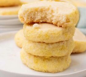 easy lemon shortbread cookies, Stacked lemon shortbread cookies on a white plate