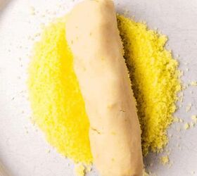 easy lemon shortbread cookies, A shortbread cookie dough log in yellow sugar on a white plate
