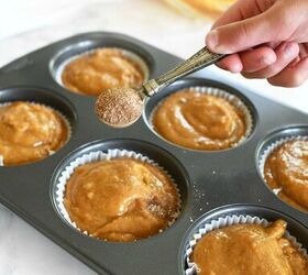 best jumbo pumpkin muffins recipe bakery style, Bakery style pumpkin muffins batter A hand is sprinkling cinnamon and sugar on these muffins