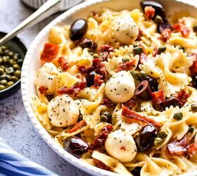 farfalle italian pasta salad, Farfalle Italian pasta salad in a served bowl next to a small bowl of capers