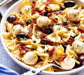 farfalle italian pasta salad, Farfalle pasta salad mixed together and served in a white serving bowl