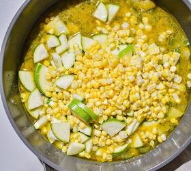 summer shrimp zucchini and corn chowder, a pot simmering with corn zucchini and shrimp