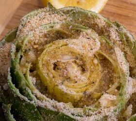 stuffed artichokes made sicilian style, An atrichoke being stuffed with breadcrumbs