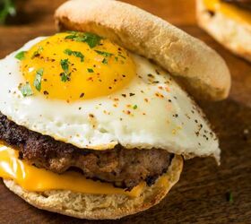 copycat sausage mcmuffin recipe english muffin sandwich, Sausage McMuffin Sandwich on a wooden serving plate