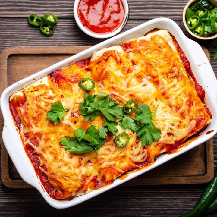 beef and bean enchiladas simple and flavorful enchilada recipe, Overhead image of Beef and Been Enchiladas in a white baking dish