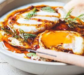 turkish eggs easy and delicious clbr recipe, Close up image of Turkish Eggs in a bowl with a knife