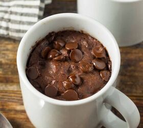 brownie in a mug microwave brownie recipe, Two servings of Brownie In A Mug on a wooden surface