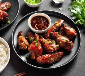 sticky chicken wings oven baked chinese chicken wings, Sticky Chicken Wings on a white plate with garnishes surrounding them