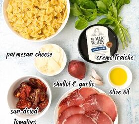 creamy bow tie pasta salad with crispy pancetta, Ingredients for a creamy bow tie pasta salad are beautifully arranged on a light surface featuring bow tie pasta pancetta parmesan cheese basil cr me fra che olive oil shallot garlic sun dried tomatoes and cherry tomatoes